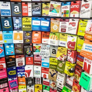 A colorful assortment of various gift cards arranged in a grid pattern.