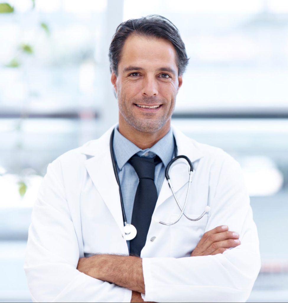 Confident male doctor with stethoscope smiling.