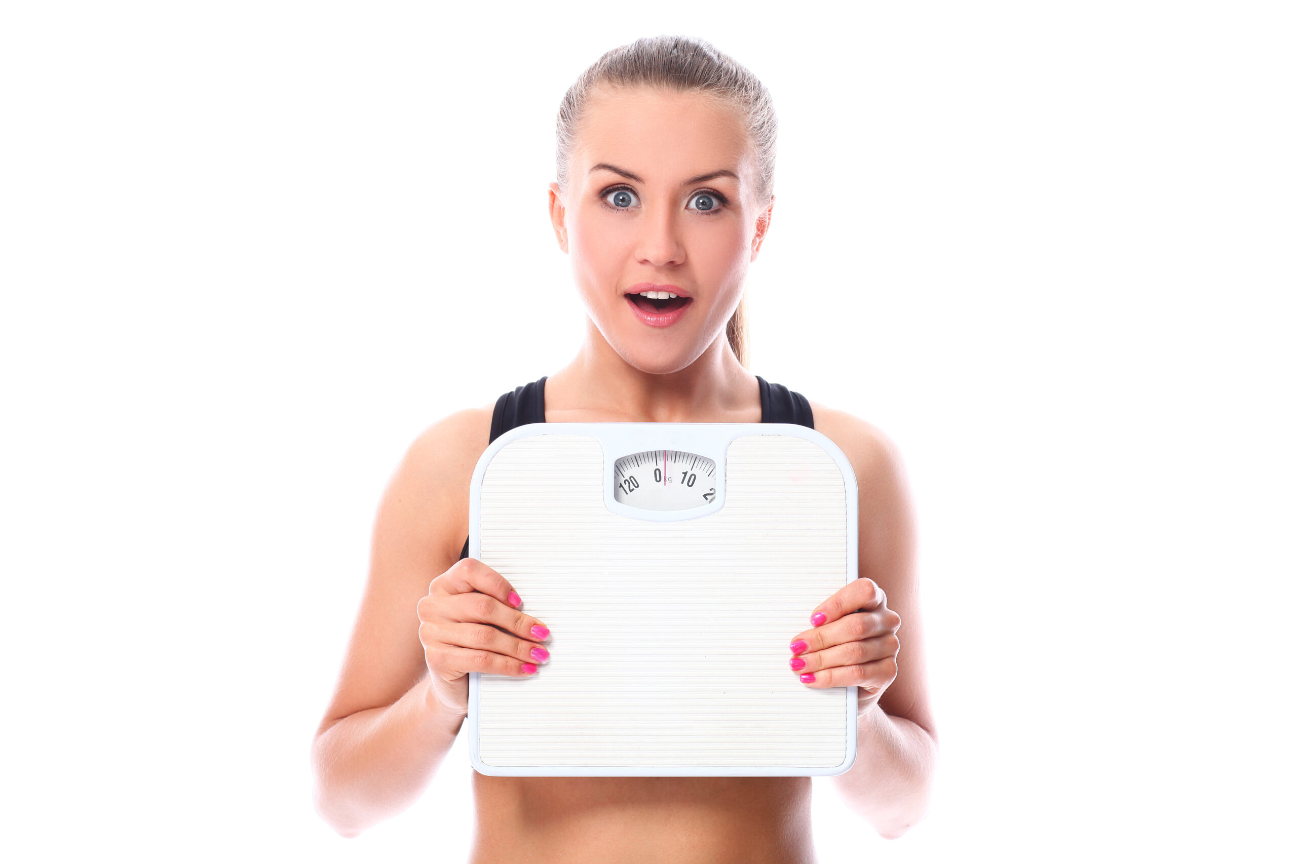 Surprised woman holding a weighing scale.